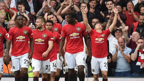 Manchester United's Daniel James (R) celebrates with teammates after scoring on his full Premier League debut against Chelsea.