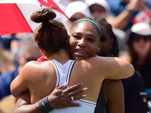 Bianca Andreescu, left, consoles Serena Williams after Williams' back spasms forced her to retire from the Rogers Cup final in Toronto on Sunday, August 11.