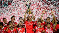 Benfica's Brazilian defender Jardel Vieira (C) holds up the winner's trophy after winning the Portugal's Super Cup final football match between SL Benfica and Sporting CP at the Algarve stadium in Faro on August 4, 2019.