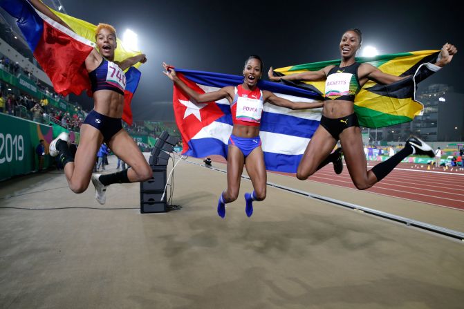 From left, Venezuela's Yulimar Rojas, Cuba's Liadagmis Povea and Jamaica's Shanieka Ricketts celebrate at the Pan American Games on Friday, August 9. Rojas won gold in the triple jump. Ricketts won silver and Povea won bronze.