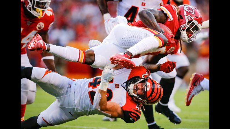 Cincinnati's Clayton Fejedelem tackles Kansas City's Tremon Smith during an NFL preseason game on Saturday, August 10.