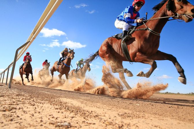 Horses race in Louth, Australia, on Saturday, August 10.