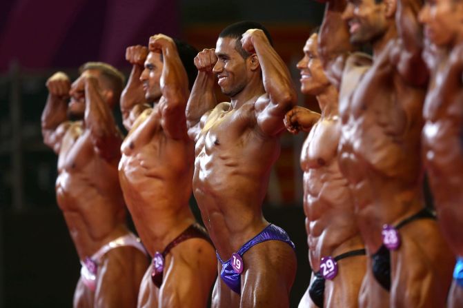 Bodybuilders flex at the Pan American Games on Saturday, August 10.