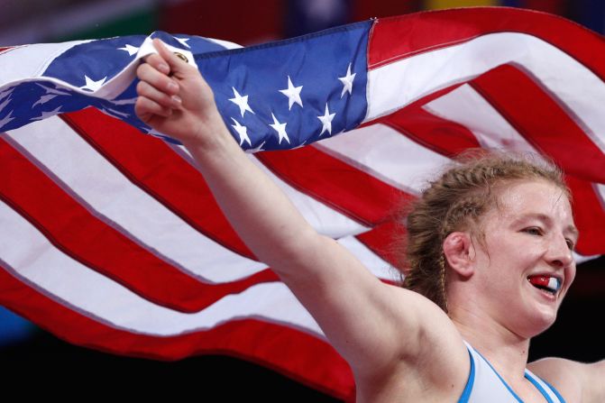US wrestler Whitney Conder runs with an American flag after winning gold in her weight class at the Pan American Games on Thursday, August 8.