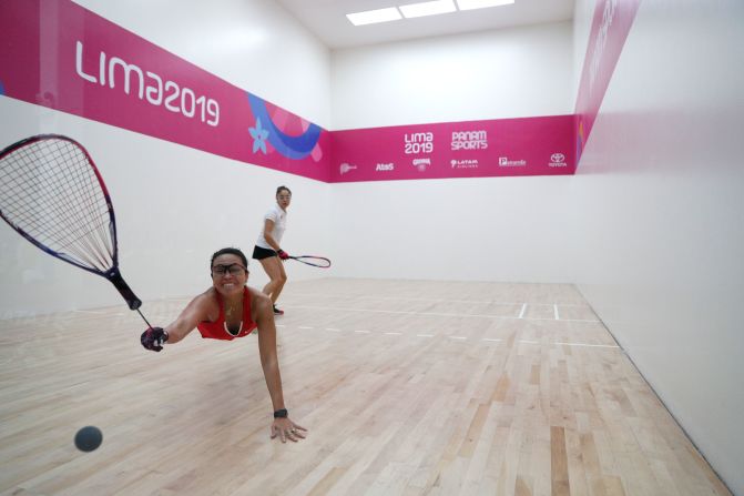 Argentina's Maria Vargas dives for a ball hit by Mexico's Paola Longoria during a racquetball match at the Pan American Games on Wednesday, August 7. Longoria won the match and the gold medal.