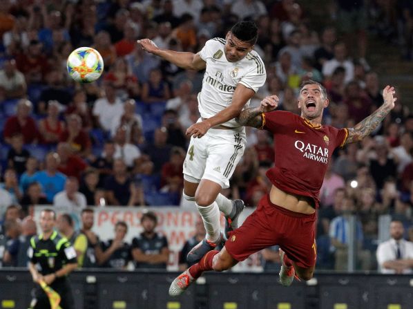Real Madrid midfielder Casemiro, left, scores his team's second goal during a preseason match against Roma on Sunday, August 11.