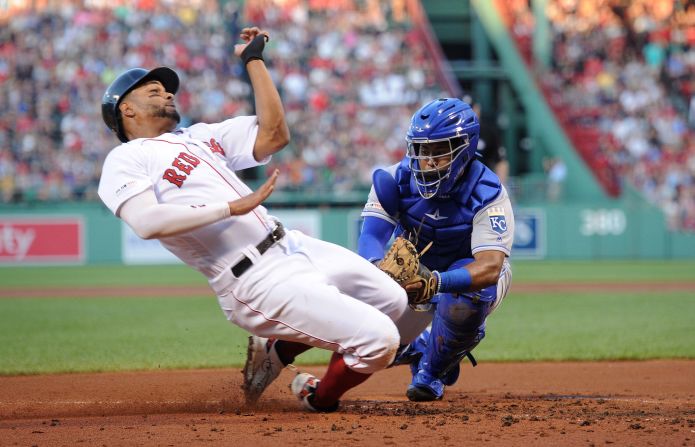 Kansas City catcher Meibrys Viloria tags out Boston's Xander Bogaerts during a Major League Baseball game in Boston on Monday, August 5.