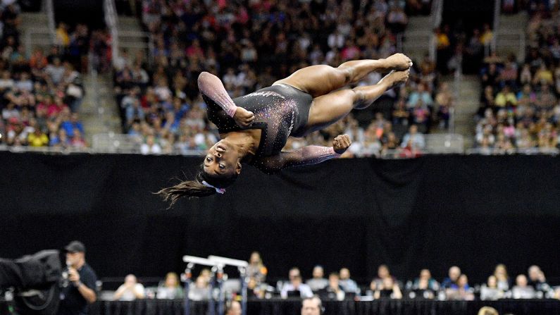 Simone Biles performs her floor routine during the US Gymnastics Championships on Sunday, August 11. Biles <a href="index.php?page=&url=https%3A%2F%2Fwww.cnn.com%2F2019%2F08%2F12%2Fsport%2Fsimone-biles-national-title%2Findex.html" target="_blank">made history</a> during the routine by becoming the first woman to land a triple-double in competition. She also won her sixth national all-around title.