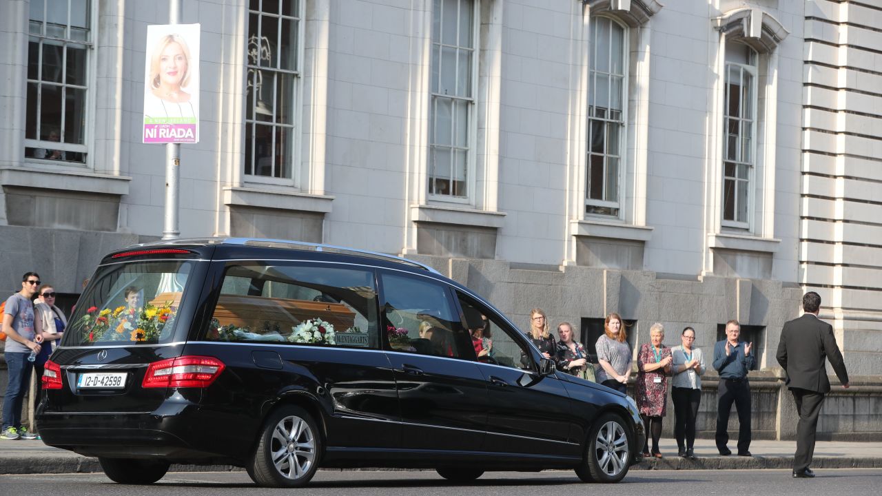 The hearse carrying the body of campaigner Emma Mhic Mhathuna, one of the most high-profile victims of Ireland's cervical smear test controversy, passes by government buildings last October. 