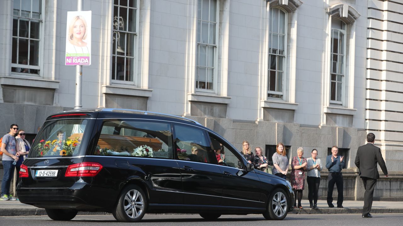 The hearse carrying the body of campaigner Emma Mhic Mhathuna, one of the most high-profile victims of Ireland's cervical smear test controversy, passes by government buildings last October.