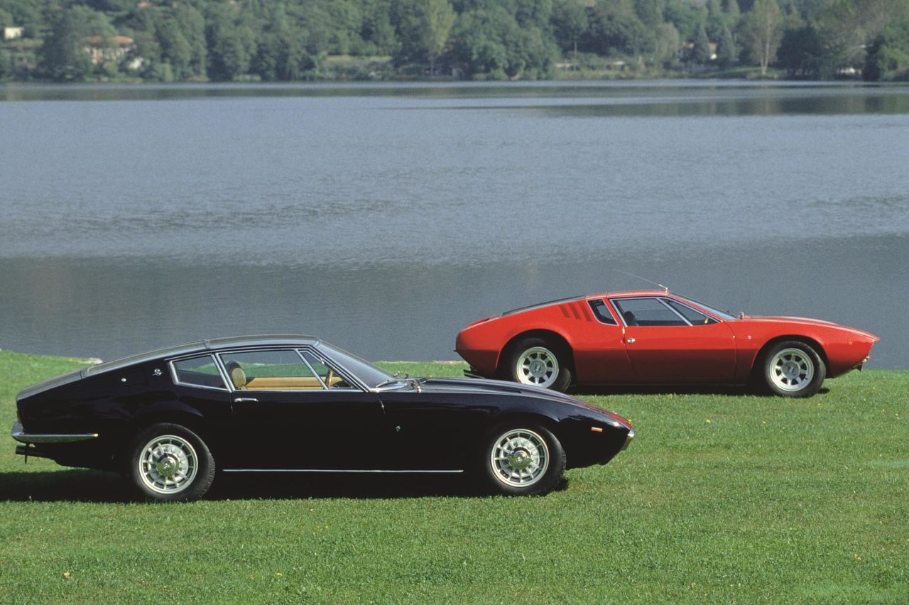 A Maserati Ghibli and, in red, a De Tomaso Mangusta.