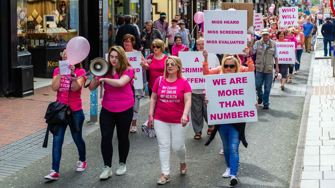 Demonstrators march in protest of the national cervical check screening program, which has been embroiled in a series of scandals for more than a year. 
