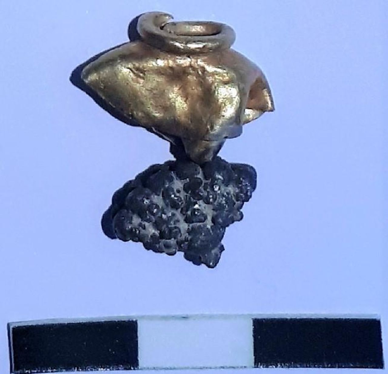 An earring or tassel ornament made from silver and gold, discovered at Mount Zion.
