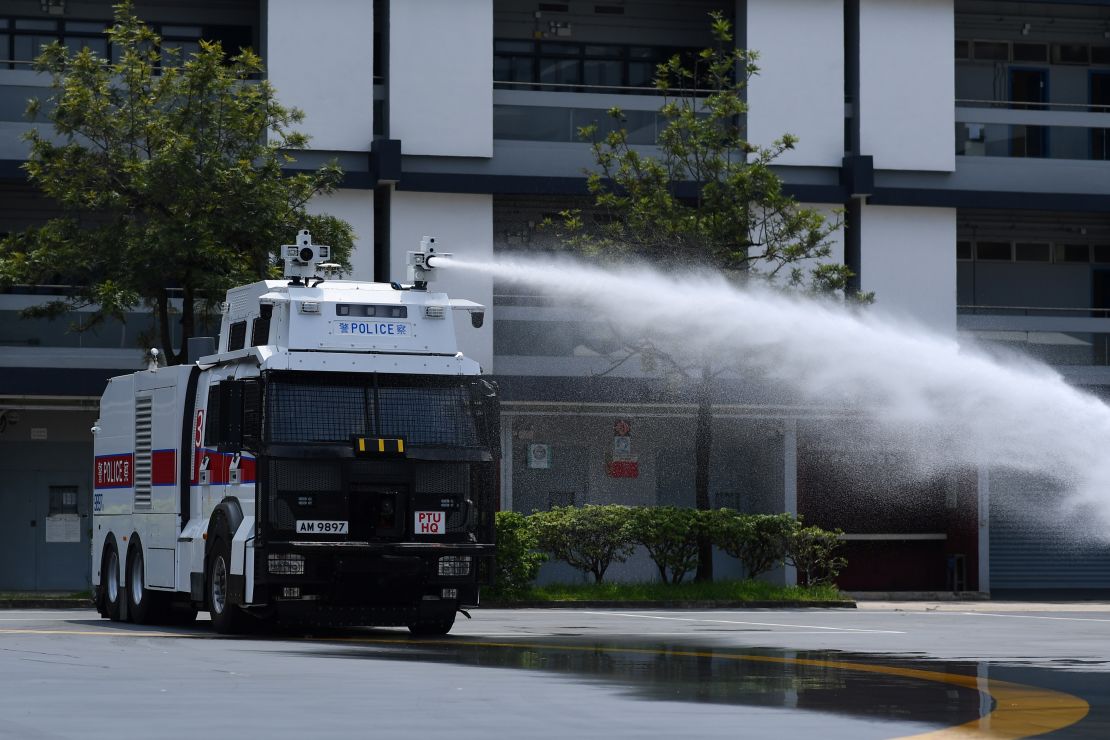 Hong Kong Police demonstrate their new water cannon equipped vehicle at the Police Tactical Unit compound in Hong Kong on August 12, 2019. 