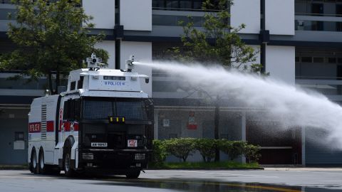 Hong Kong Police demonstrate their new water cannon equipped vehicle at the Police Tactical Unit compound in Hong Kong on August 12, 2019. 