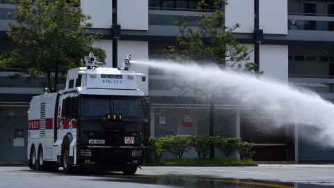 Hong Kong Police demonstrate their new water cannon equipped vehicle at the Police Tactical Unit compound in Hong Kong on August 12, 2019.