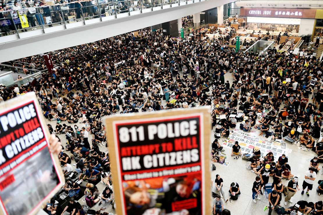 Pro-democracy protesters gather against the police brutality and the controversial extradition bill at Hong Kong's international airport on August 12, 2019.