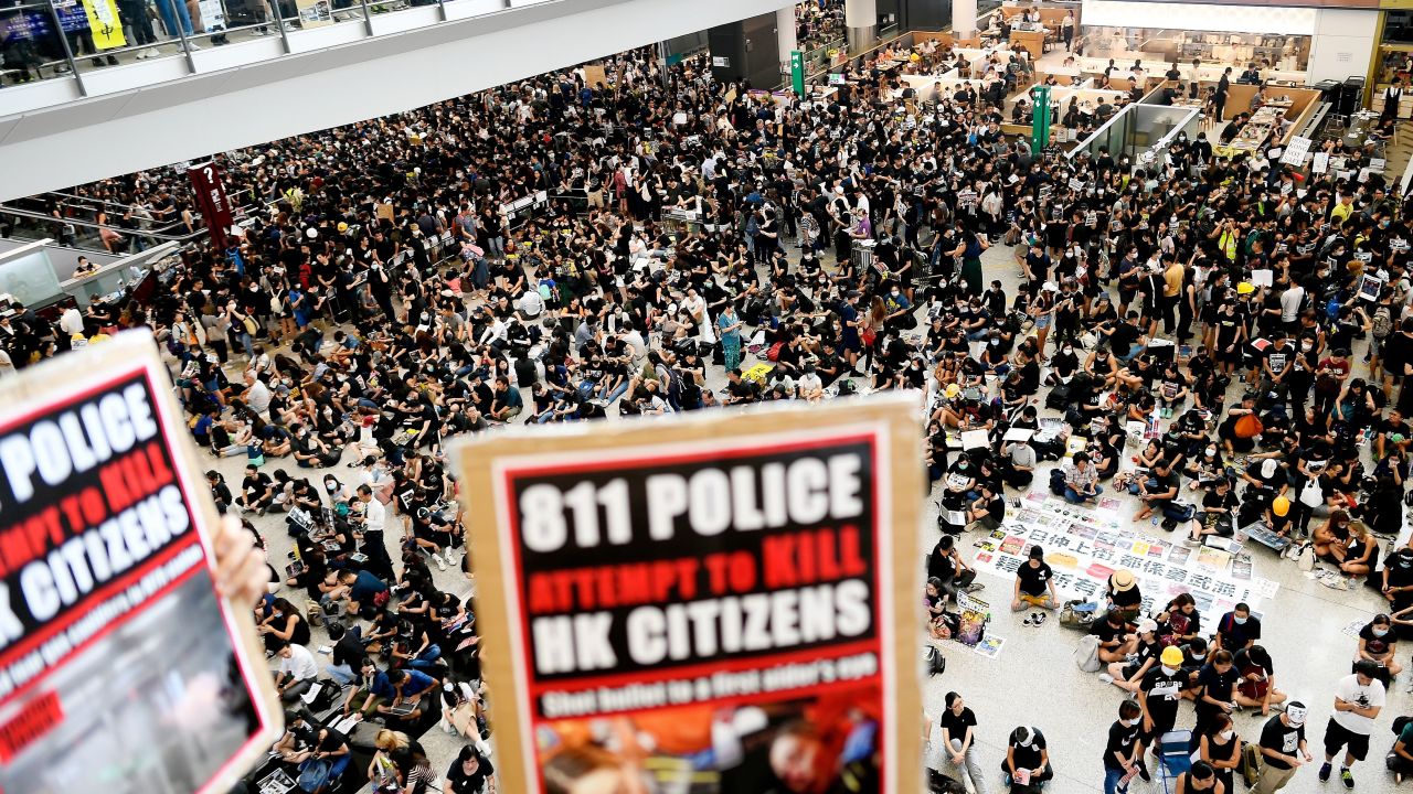 Pro-democracy protesters gather against the police brutality and the controversial extradition bill at Hong Kong's international airport on August 12, 2019.