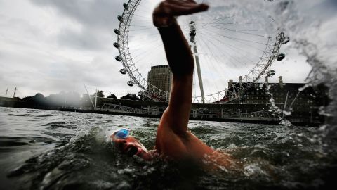 Endurance swimmer and conservationist Lewis Pugh swims in the Thames River in London.
