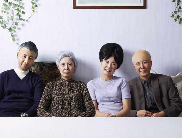 Yamada selects images where people were posing, aware of the camera, and actively conveying the sense that they were a family unit.