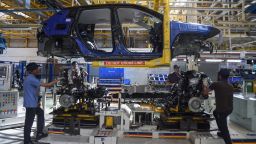 In this photograph taken on July 23, 2019 workers assemble a car at a FCA India Automobiles manufacturing facility in Ranjangaon, some 200km east of Mumbai. (Photo by Indranil MUKHERJEE / AFP)        (Photo credit should read INDRANIL MUKHERJEE/AFP/Getty Images)
