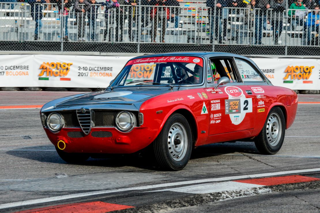 A classic Alfa Romeo Giulia Sprint GT, produced from 1963 and one of Giugiaro's first designs at Bertone, in a race in Bologna in 2017.