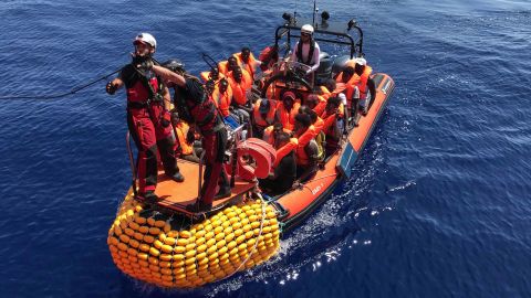 An inflatable dinghy, belonging to the "Ocean Viking" rescue ship, operated by French NGOs SOS Mediterranee and Medecins sans Frontieres (MSF), rescues migrants in the Mediterranean in August 2019.