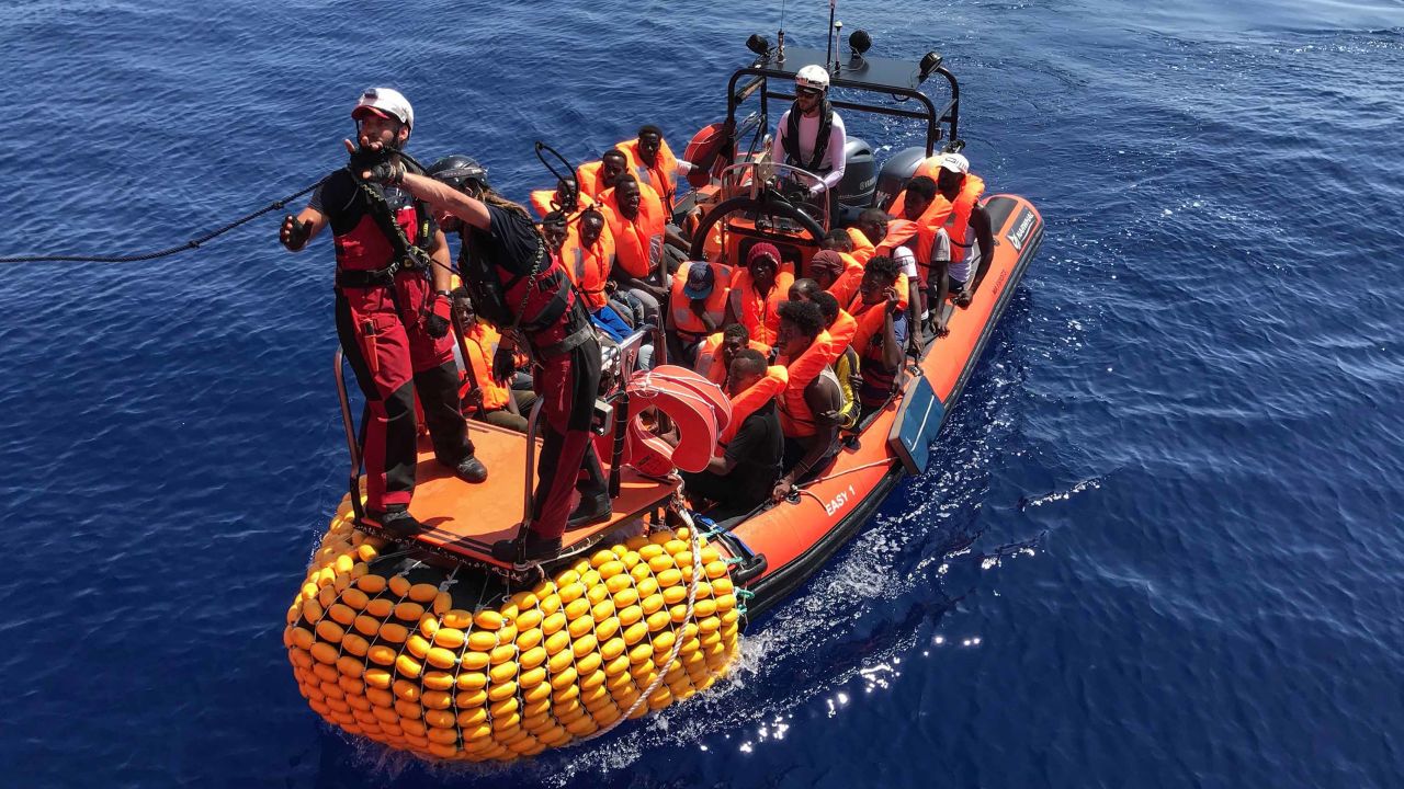 An inflatable dinghy, belonging to the "Ocean Viking" rescue ship, operated by French NGOs SOS Mediterranee and Medecins sans Frontieres (MSF), rescues migrants in the Mediterranean in August 2019.