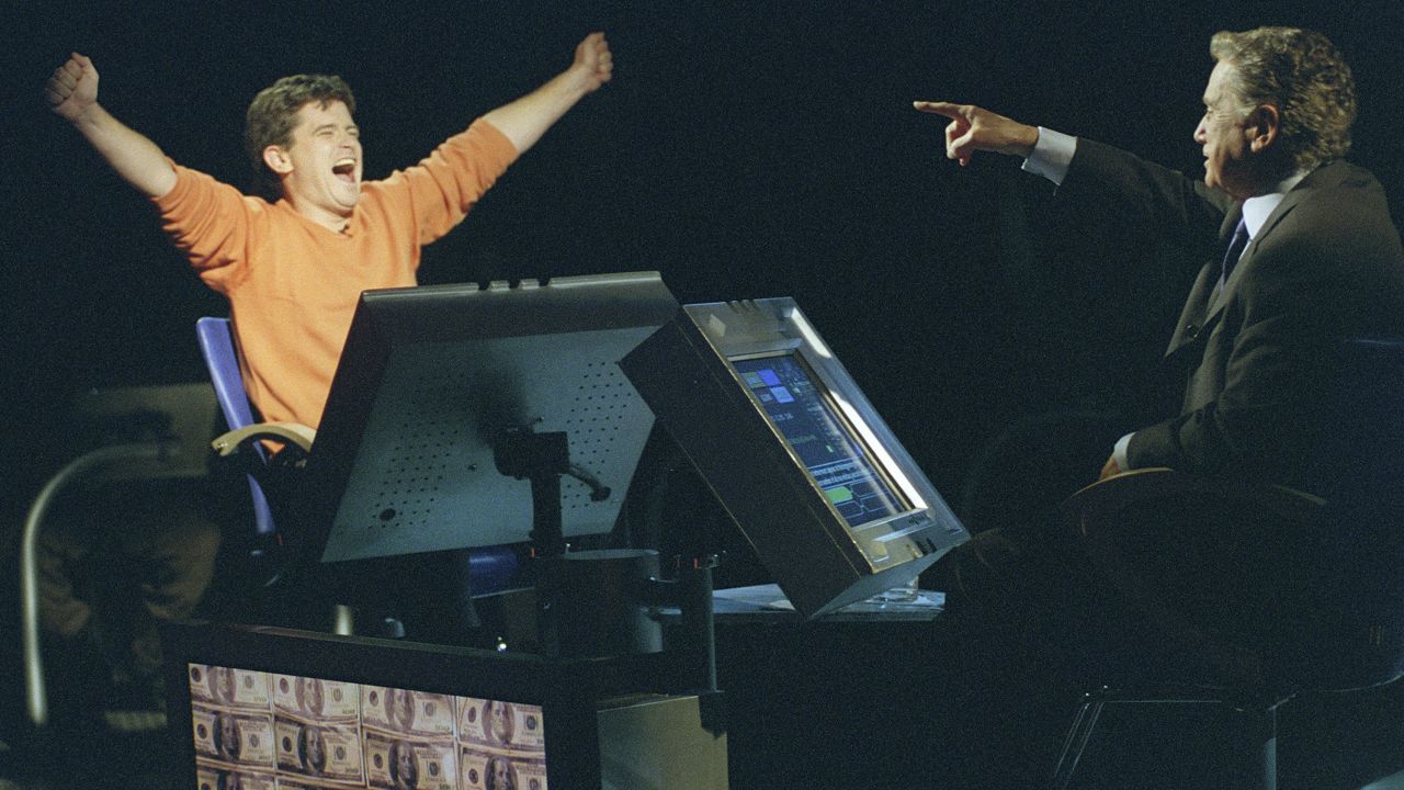 Contestant Bernie Cullen (left) with Regis Philbin in a 2001 episode of 'Who Wants to Be a Millionaire.' (Photo by Maria Melin/Walt Disney Television via Getty Images)