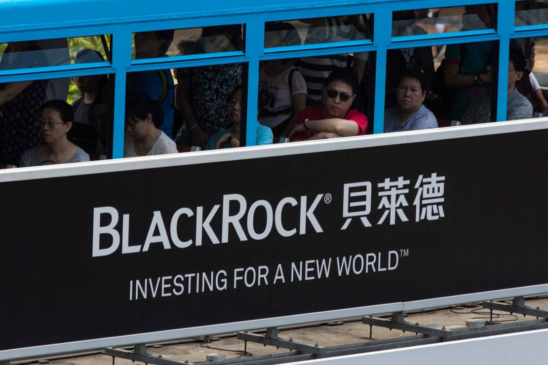 A tram moving past a BlackRock advertisement in Admiralty, Hong Kong.