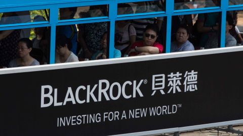A tram moving past a BlackRock advertisement in Admiralty, Hong Kong.