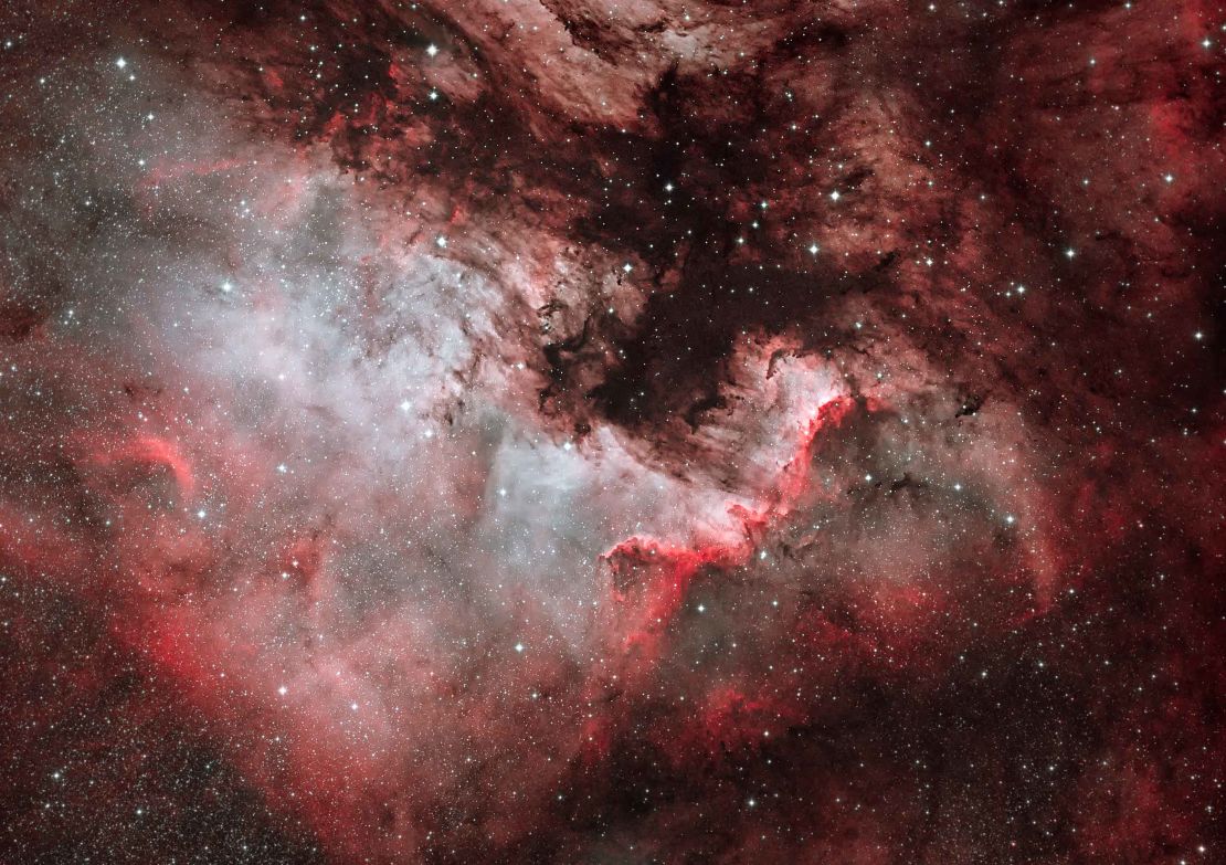 North America Nebula by Dave Watson. A nebula is an interstellar cloud of dust. The North America Nebula, NGC7000, is an emission nebula in the constellation Cygnus. The remarkable shape of the nebula resembles that of the continent of North America, complete with a prominent Gulf of Mexico.