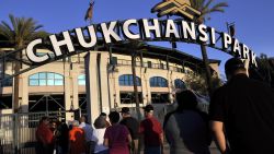 This Sept. 18, 2015 photo shows fans arrive at Chukchansi Park in Fresno, Calif., for a minor-league baseball game between the Fresno Grizzlies and the Round Rock Express. Fresno authorities say a man died shortly after competing in a taco-eating contest at a Grizzlies game. Fresno Sheriff spokesman Tony Botti says 41-year-old Dana Hutchings, of Fresno, died Tuesday, Aug. 13, 2019 shortly after arriving at a hospital. Botti says an autopsy on Hutchings will be done Thursday to determine a cause of death.  (Eric Paul Zamora/The Fresno Bee via AP)