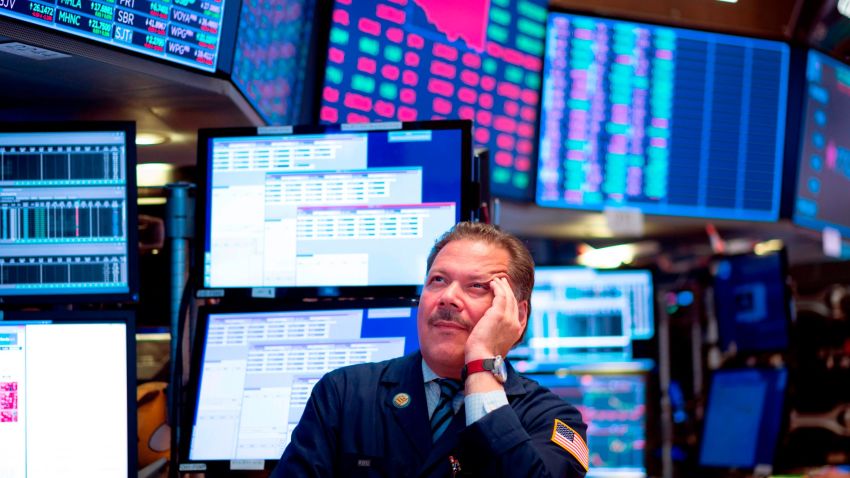 Traders work before the closing bell at the New York Stock Exchange (NYSE) on August 14, 2019 in New York City. - It was an ugly day for Wall Street, as stocks plummeted Wednesday amid worsening economic fears after US Treasury yields briefly inverted, flashing a warning sign for a coming recession. But US President Donald Trump once again blamed the Fed for the economic woes and the yield curve inversion, saying the US central bank is a bigger threat than China and is "clueless." The Dow Jones Industrial Average fell 3.1 percent to finish at 25,479.42, a loss of about 800 points -- its worst day of 2019. (Photo by Johannes EISELE / AFP)        (Photo credit should read JOHANNES EISELE/AFP/Getty Images)