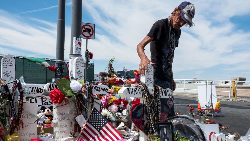 Antonio Basco visits a memorial for the victims of the Aug. 3 mass shooting in El Paso, across from the Walmart where the shooting took place in El Paso, Texas, Wednesday, Aug. 14, 2019. Basco's wife, Margie Reckard, 63, was killed in the shooting.