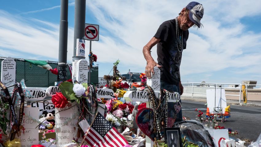 Antonio Basco visits a memorial for the victims of the Aug. 3 mass shooting in El Paso, across from the Walmart where the shooting took place in El Paso, Texas, Wednesday, Aug. 14, 2019. Basco's wife, Margie Reckard, 63, was killed in the shooting.