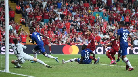Virgil van Dijk is denied by Kepa Arrizabalaga from close range.