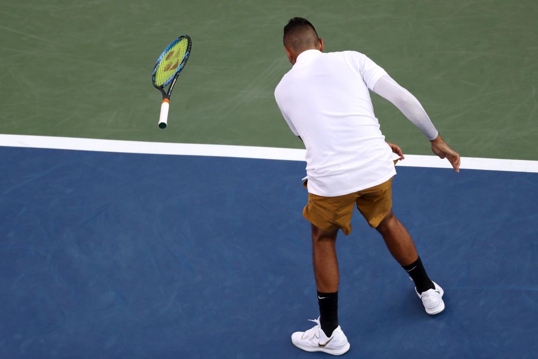 Kyrgios throws his racket during a match against Lorenzo Sonego.