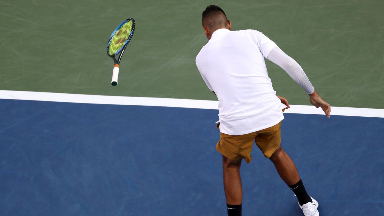 Kyrgios throws his racket during a match against Lorenzo Sonego.