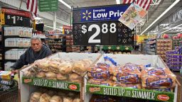 A man pushes his shopping cart past bread for sale at a Walmart Supercenter store in Rosemead, California on May 23, 2019. - Walmart has said it will raise prices as a result of the Trump administration's tariffs on Chinese-made goods as the trade war is about to take a bite into the retail sector affecting consumers shopping at stores like Walmart, Target and Macy's. (Photo by Frederic J. BROWN / AFP)        (Photo credit should read FREDERIC J. BROWN/AFP/Getty Images)