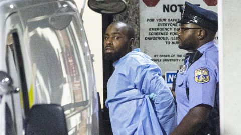 Police take shooting suspect Maurice Hill into custody in Philadelphia early Thursday, August 15, 2019, following a long standoff.