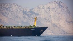 A view of the Grace 1 supertanker is seen backdropped by Gibraltar's Rock, as it stands at anchor in the British territory of Gibraltar, Thursday, Aug. 15, 2019, seized last month in a British Royal Navy operation off Gibraltar.  The United States moved on Thursday to halt the release of the Iranian supertanker Grace 1, detained in Gibraltar for breaching EU sanctions on oil shipments to Syria, thwarting efforts by authorities in London and the British overseas territory to defuse tensions with Tehran.(AP Photo/Marcos Moreno)