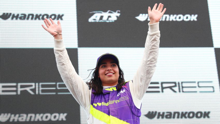 LONGFIELD, ENGLAND - AUGUST 11:  Jamie Chadwick of Great Britain celebrates on the podium after winning the inaugural W Series Championship at Brands Hatch on August 11, 2019 in Longfield, England. (Photo by Dan Istitene/Getty Images)