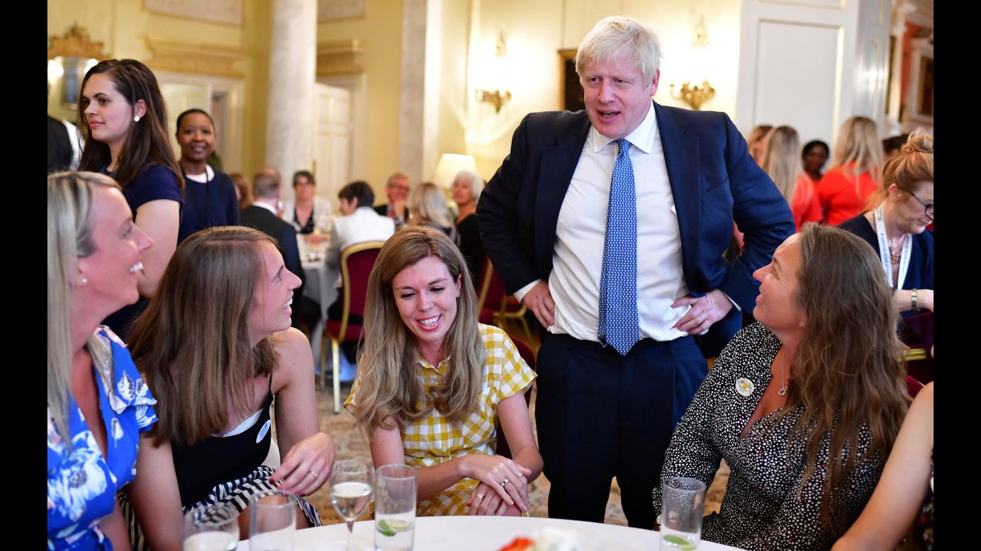 British Prime Minister Boris Johnson attends a reception for hospice workers Monday, August 12, at No. 10 Downing Street in London. At center is his girlfriend, Carrie Symonds. Never in living memory has a UK Prime Minister <a href="https://www.cnn.com/2019/07/26/uk/carrie-symonds-boris-johnson-girlfriend-gbr-intl/index.html" target="_blank">had an unmarried partner while in office.</a>