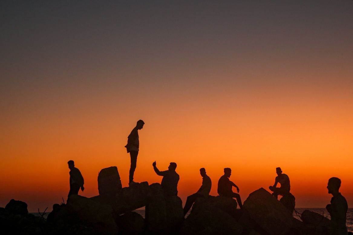 People in Gaza City sit and take pictures by the Mediterranean Sea on Tuesday, August 13. <a href="http://www.cnn.com/2019/08/08/world/gallery/week-in-photos-0808/index.html" target="_blank">See last week in 23 photos</a>