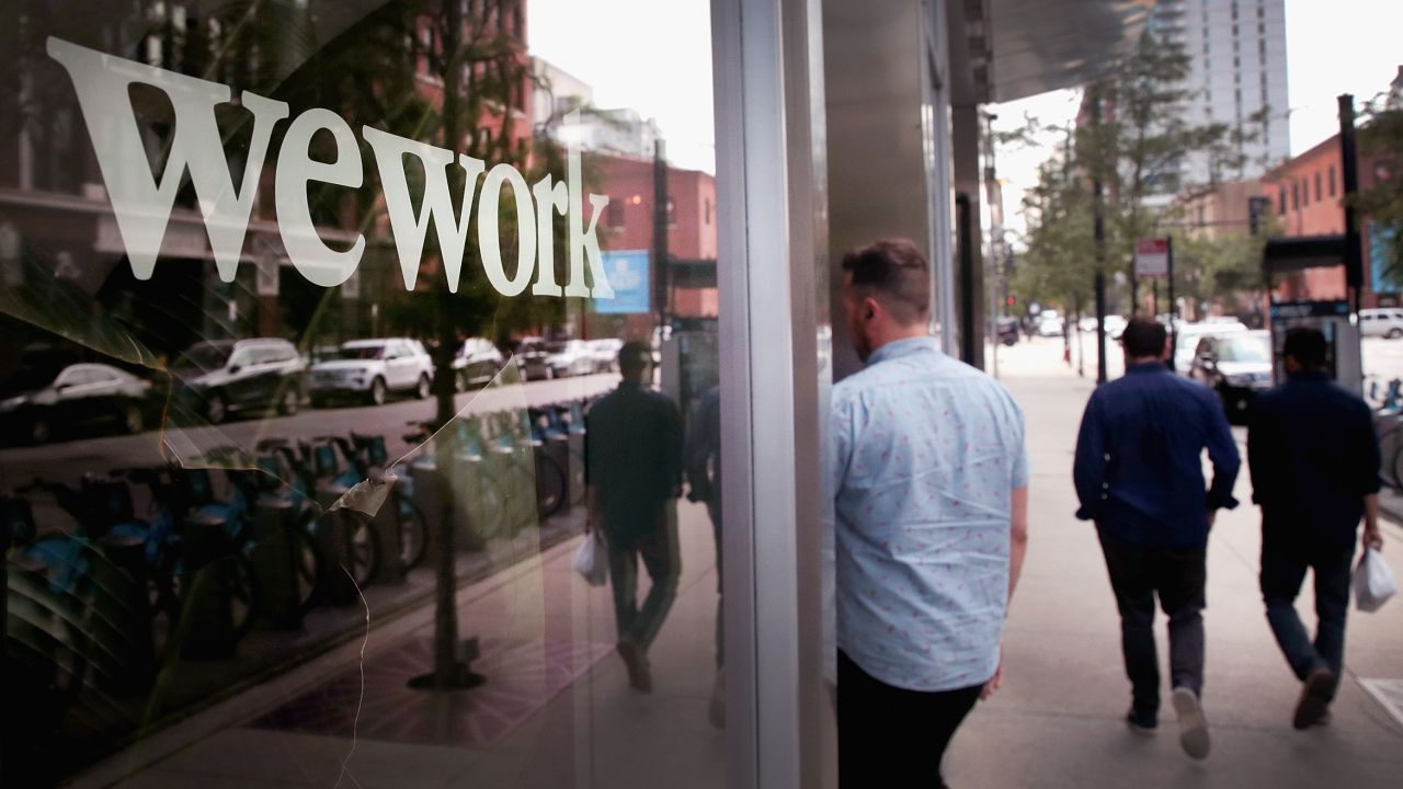 CHICAGO, ILLINOIS - AUGUST 14:  A sign marks the location of a WeWork office facility on August 14, 2019 in Chicago, Illinois. WeWork, a real estate firm that leases shared office space, announced today that it had filed a financial prospectus with regulators to become a publicly traded company. (Photo by Scott Olson/Getty Images)