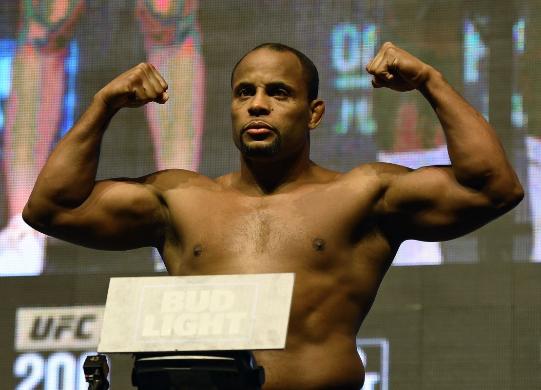 Cormier poses on the scale during his weigh-in for UFC 200.