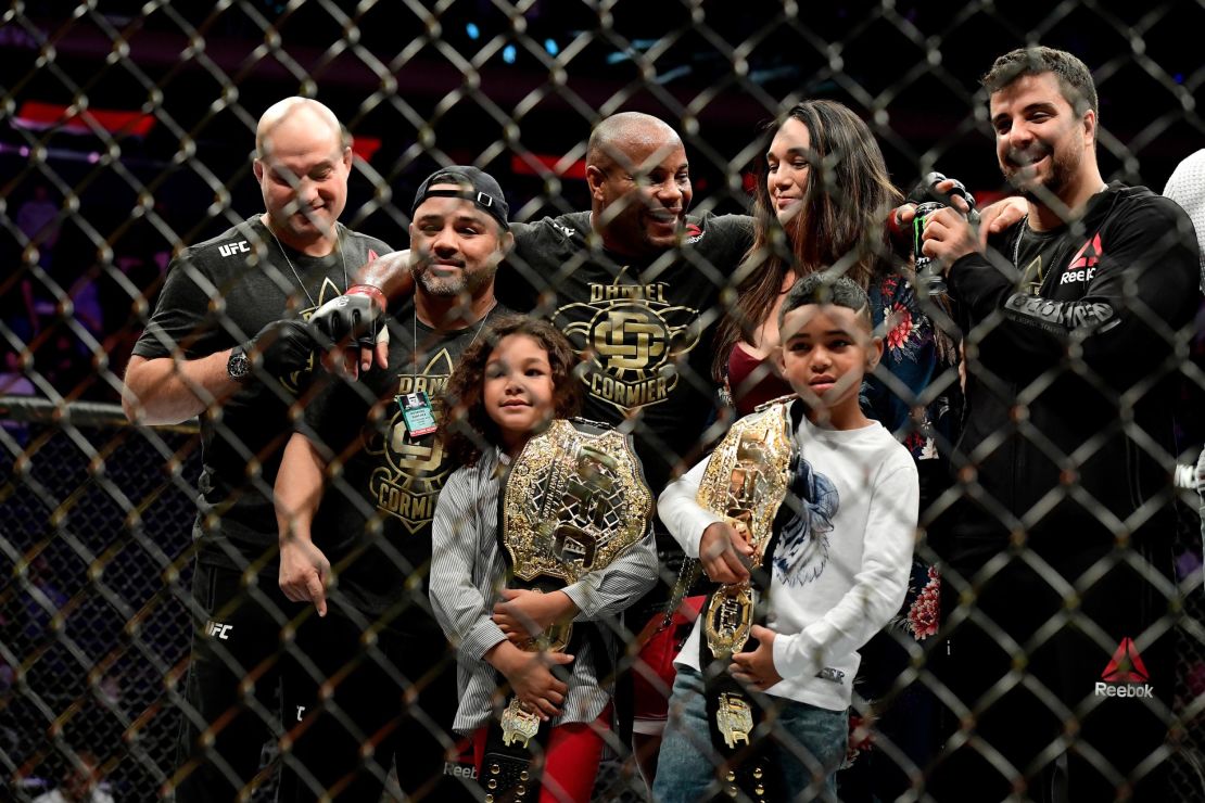 Cormier celebrates with his family and team after his win over Derrick Lewis.
