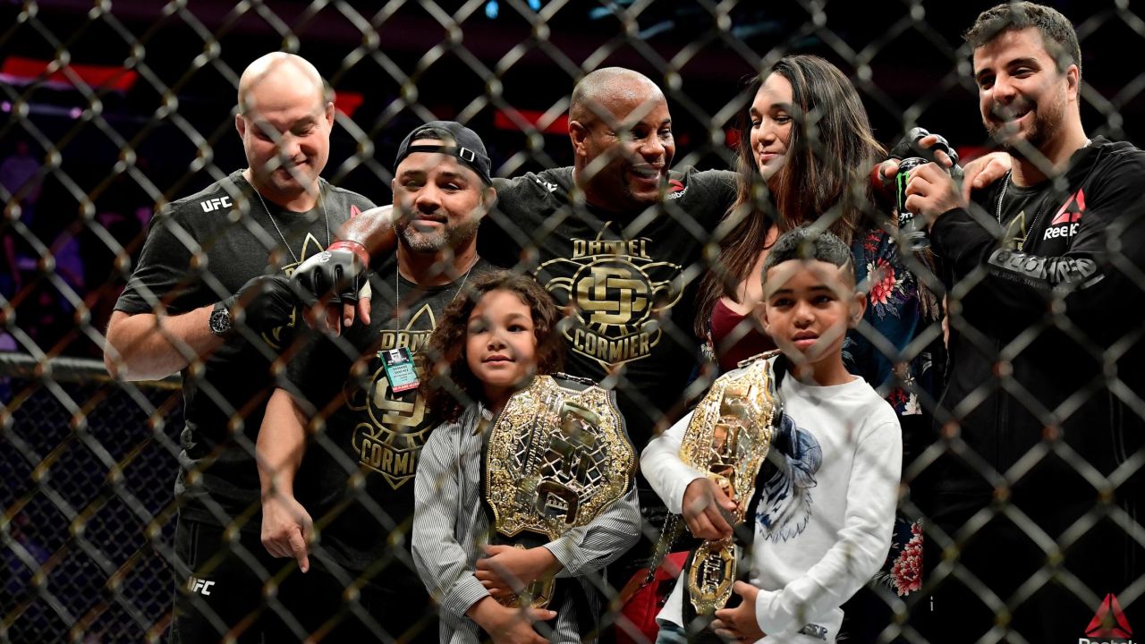 Cormier celebrates with his family and team after his win by submission over Derrick Lewis in 2018.