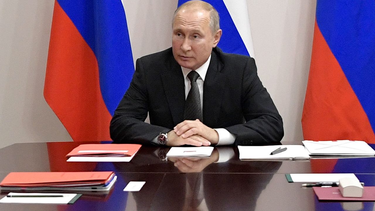 Russian President Vladimir Putin chairs a Security Council meeting in Anapa, South Russia, Friday, Aug. 16, 2019. Russian President Vladimir Putin on Friday awarded the nation's highest medal, the Hero of Russia, to the pilot who managed to smoothly land his disabled passenger plane in a cornfield after a flock of birds hit both engines and knocked them out. (Alexei Nikolsky, Sputnik, Kremlin Pool Photo via AP)